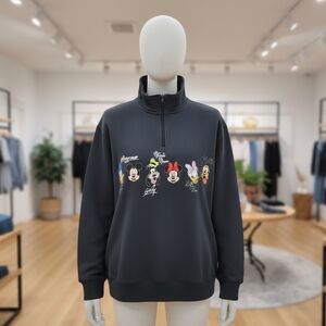 A Disney Parks Black 1/4 Zip sweatshirt featuring an embroidered design Size 1X